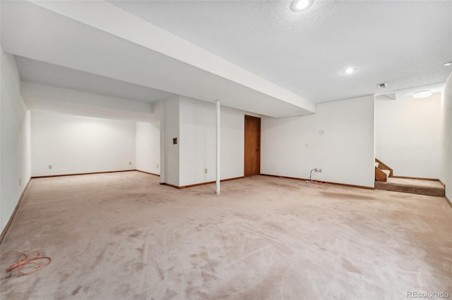 finished basement with carpet flooring, recessed lighting, and baseboards