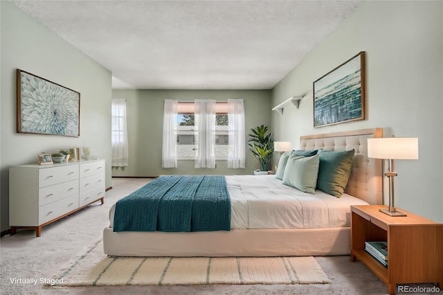 bedroom with carpet floors and multiple windows