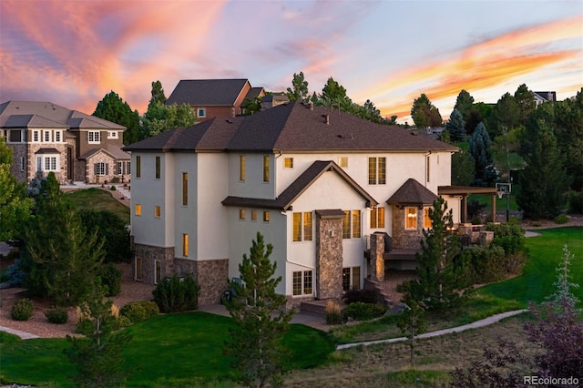 view of front of home with a yard