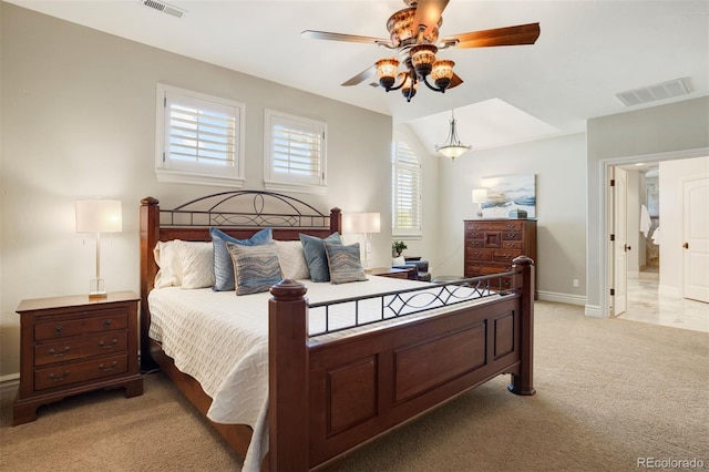 bedroom featuring ceiling fan, light colored carpet, and vaulted ceiling