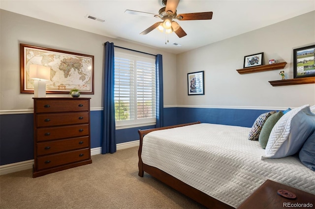 bedroom with ceiling fan and light colored carpet