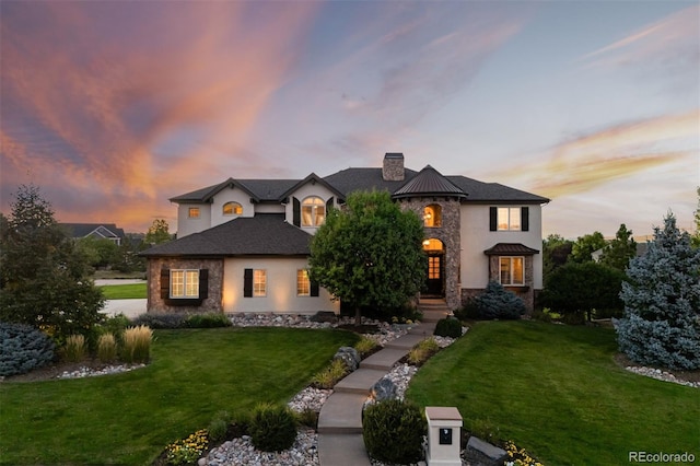 view of front of house with a yard