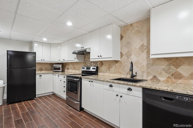 kitchen featuring dark hardwood / wood-style flooring, sink, white cabinetry, and black appliances