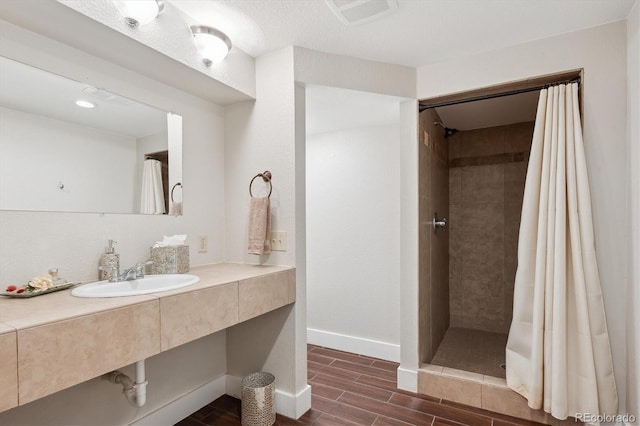 bathroom featuring sink and a shower with shower curtain