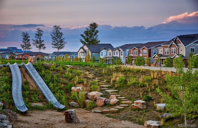 21176 E 62nd Dr, Aurora, CO 80019 - yard at dusk featuring a residential view
