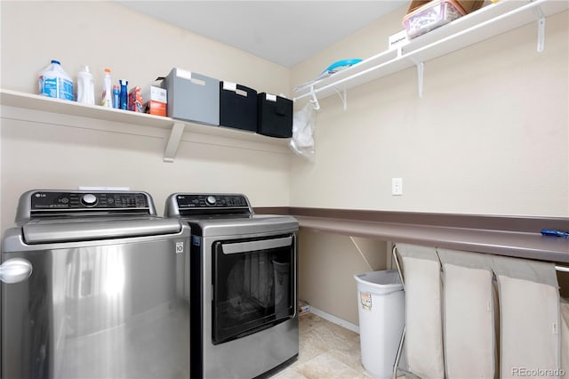 clothes washing area with independent washer and dryer