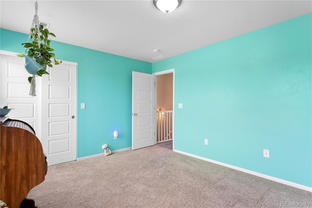 unfurnished bedroom featuring carpet