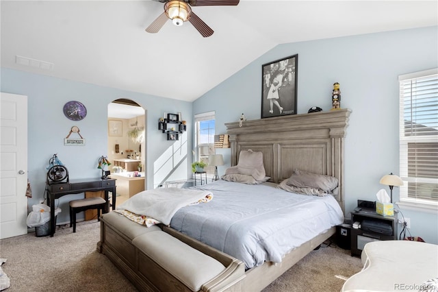 carpeted bedroom featuring ceiling fan and vaulted ceiling