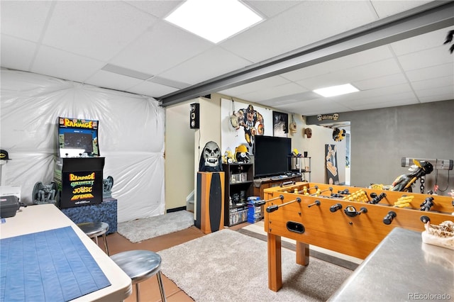 playroom featuring a paneled ceiling