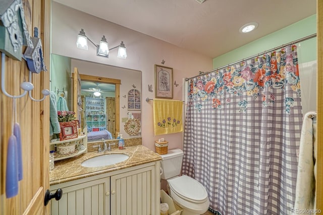 8126 Buck Run, Salida, CO 81201 - full bathroom with toilet, vanity, connected bathroom, a shower with shower curtain, and a ceiling fan