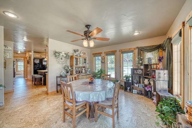 8126 Buck Run, Salida, CO 81201 - dining space with healthy amount of natural light, ceiling fan, recessed lighting, and baseboards