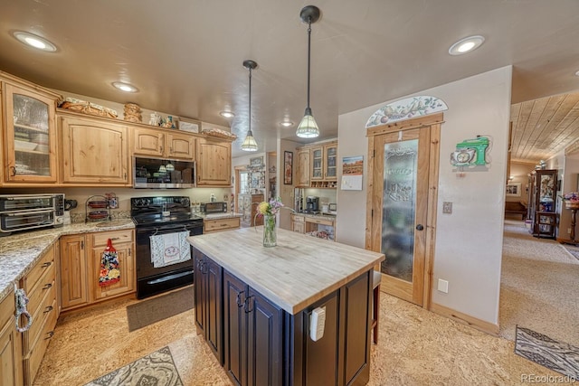 8126 Buck Run, Salida, CO 81201 - kitchen featuring electric range, stainless steel microwave, glass insert cabinets, hanging light fixtures, and a center island