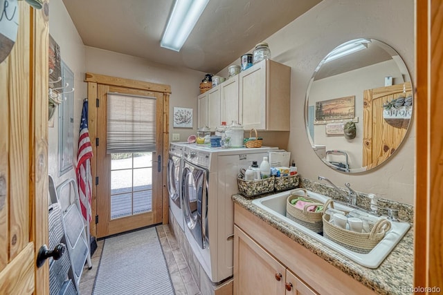 8126 Buck Run, Salida, CO 81201 - laundry area featuring cabinet space, washer and dryer, and light tile patterned floors