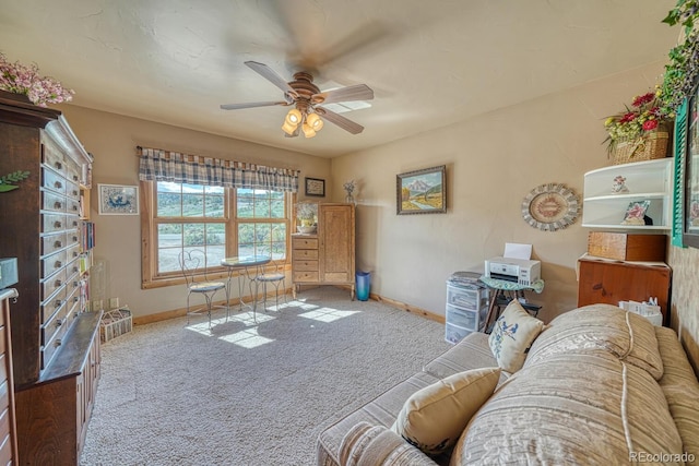 8126 Buck Run, Salida, CO 81201 - living area featuring carpet, baseboards, and a ceiling fan