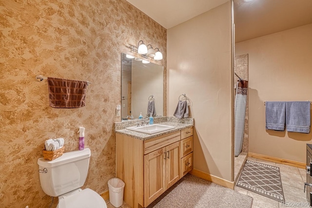 8126 Buck Run, Salida, CO 81201 - bathroom featuring toilet, vanity, a shower with shower curtain, tile patterned floors, and baseboards