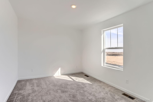 3909 N Shawnee St, Aurora, CO 80019 - empty room featuring carpet flooring, baseboards, and visible vents