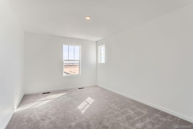 3909 N Shawnee St, Aurora, CO 80019 - carpeted empty room featuring baseboards