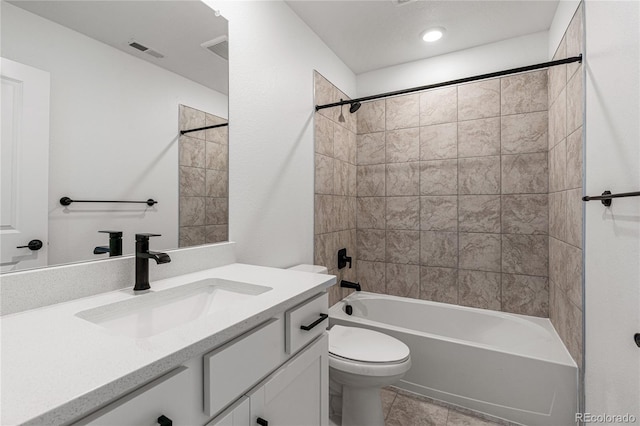 full bathroom featuring vanity, toilet, and tiled shower / bath combo