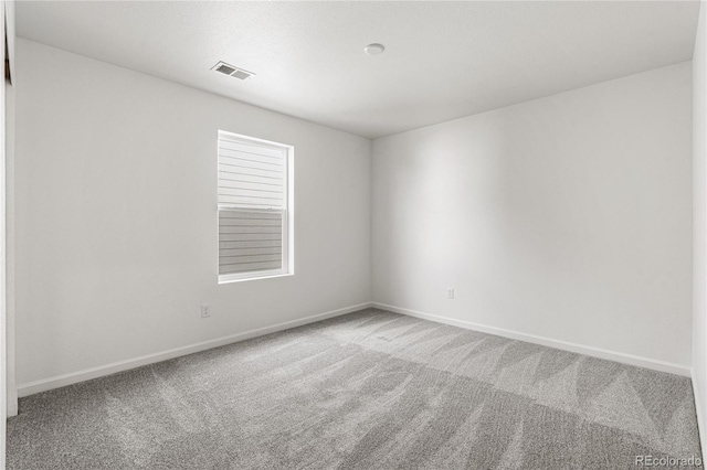 spare room with carpet floors