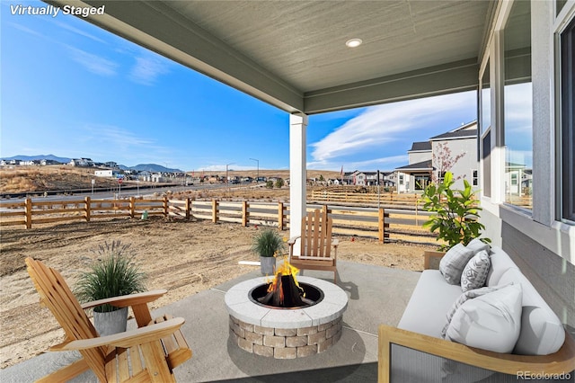 9359 Russell Cir, Arvada, CO 80007 - fenced backyard featuring an outdoor fire pit and a patio area