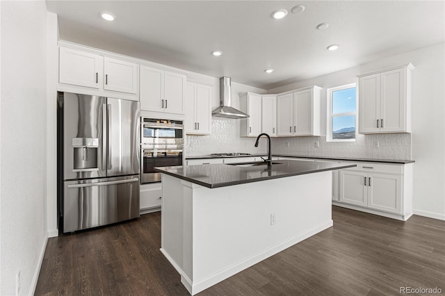 9359 Russell Cir, Arvada, CO 80007 - kitchen with stainless steel appliances, wall chimney exhaust hood, a sink, dark countertops, and dark wood-style flooring