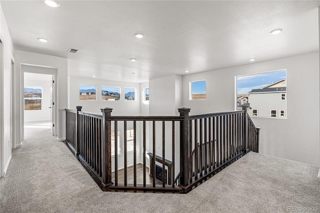 9359 Russell Cir, Arvada, CO 80007 - hall with an upstairs landing, carpet floors, and recessed lighting