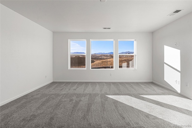 9359 Russell Cir, Arvada, CO 80007 - spare room featuring carpet, baseboards, and a mountain view