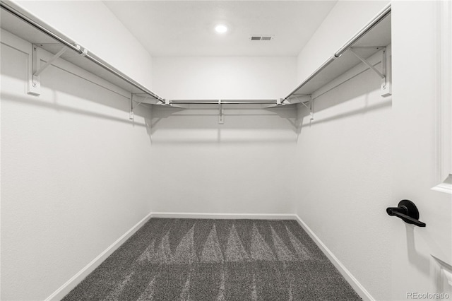 9359 Russell Cir, Arvada, CO 80007 - walk in closet featuring dark carpet