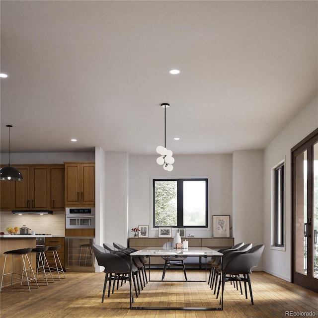 dining room featuring french doors and light hardwood / wood-style floors