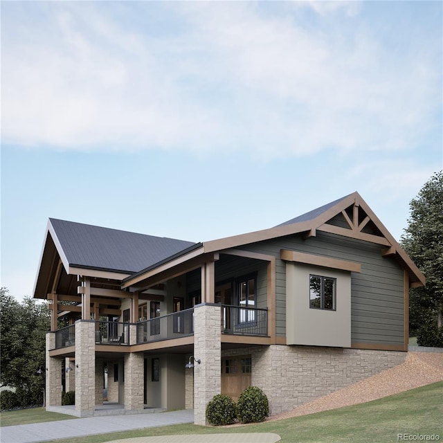 exterior space featuring a balcony and a yard