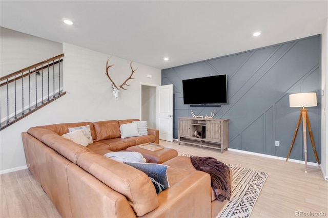 living room with light hardwood / wood-style flooring