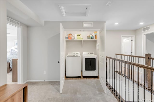 laundry area featuring light colored carpet and independent washer and dryer