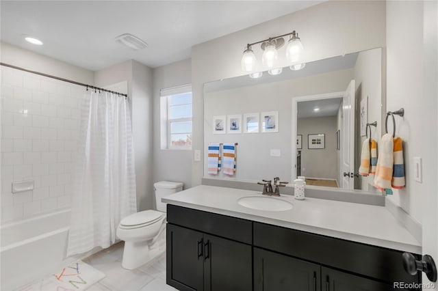 full bathroom featuring tile patterned floors, shower / bath combo with shower curtain, vanity, and toilet