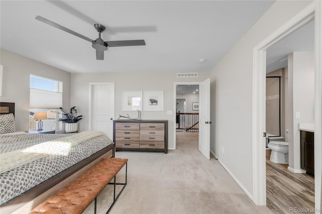 carpeted bedroom featuring ceiling fan and connected bathroom