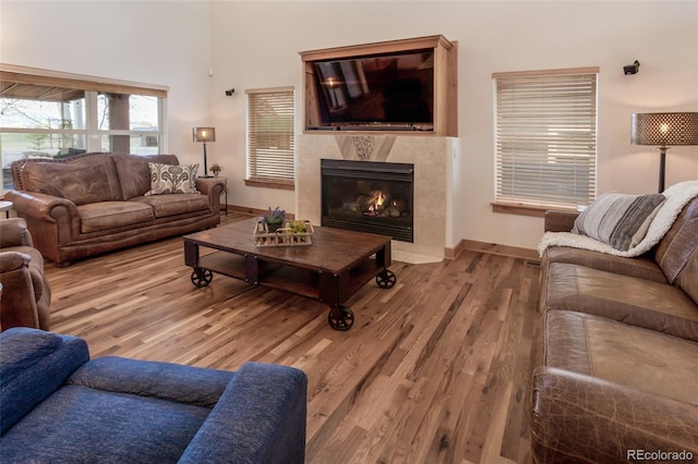 1715 Wales Dr, Berthoud, CO 80513 - living area with wood finished floors and a tiled fireplace