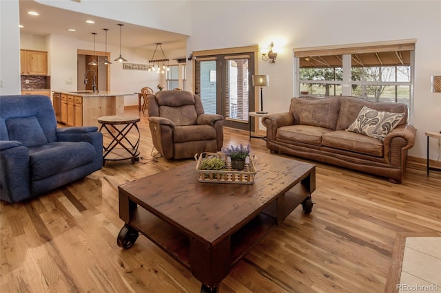 1715 Wales Dr, Berthoud, CO 80513 - living area with light wood-style flooring and recessed lighting
