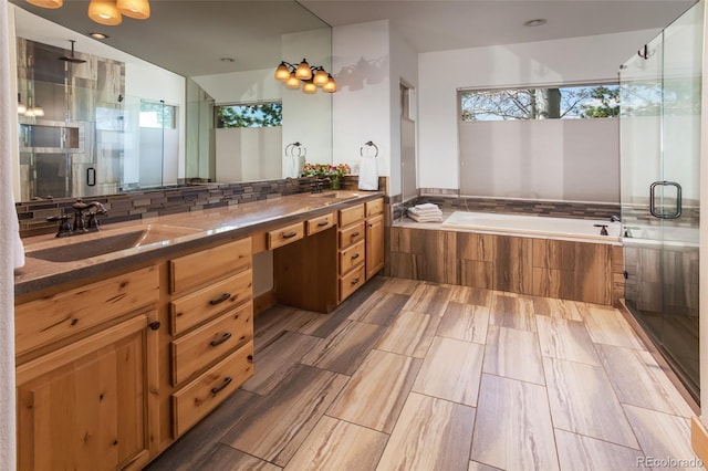 1715 Wales Dr, Berthoud, CO 80513 - full bath featuring a shower stall, a bath, and double vanity