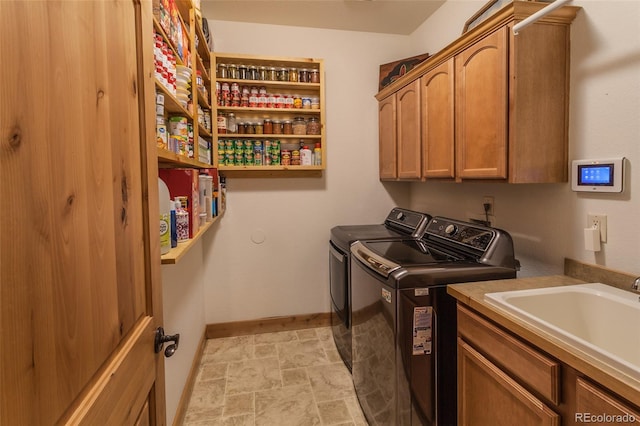 1715 Wales Dr, Berthoud, CO 80513 - washroom featuring washing machine and dryer, cabinet space, and stone finish floors