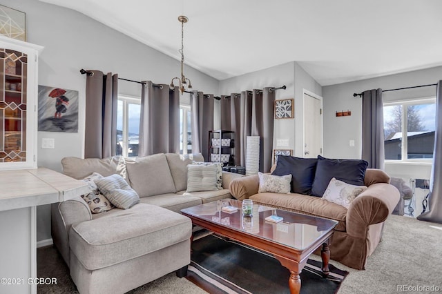 carpeted living area featuring lofted ceiling