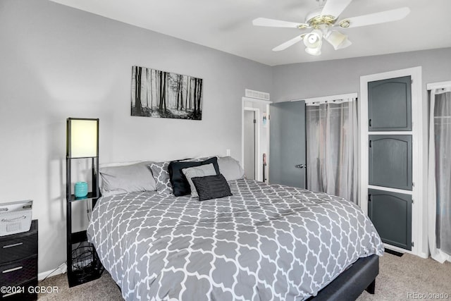 carpeted bedroom featuring a ceiling fan and baseboards