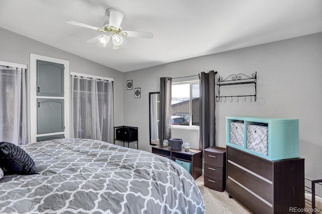 bedroom with light carpet, lofted ceiling, and ceiling fan