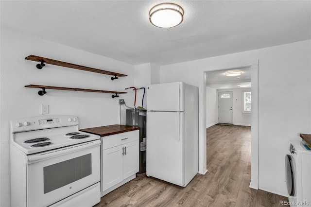 kitchen featuring light hardwood / wood-style floors, electric water heater, white appliances, washer / dryer, and white cabinets