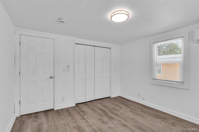 unfurnished bedroom with light hardwood / wood-style floors