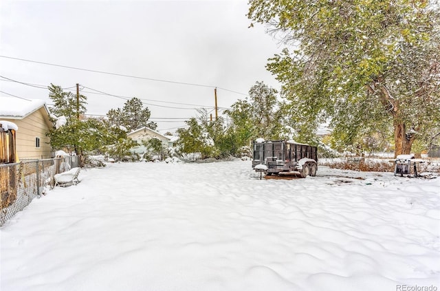 view of yard layered in snow