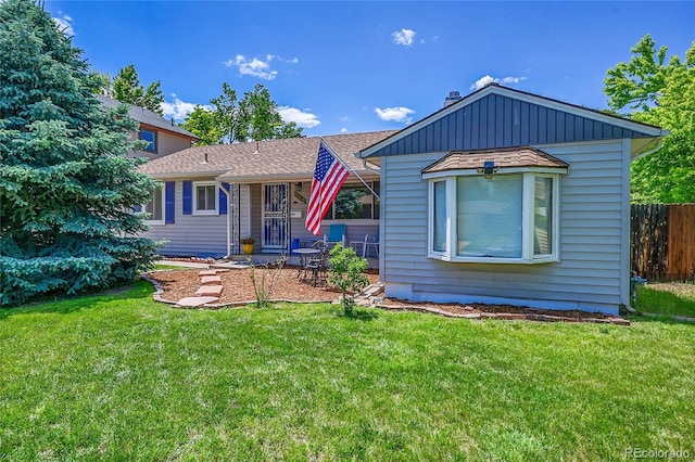 3313 S Dexter St, Denver, CO 80222 - view of front of house featuring roof with shingles