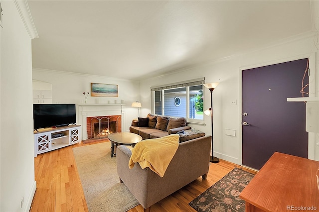 3313 S Dexter St, Denver, CO 80222 - living room featuring crown molding, a brick fireplace, and wood finished floors