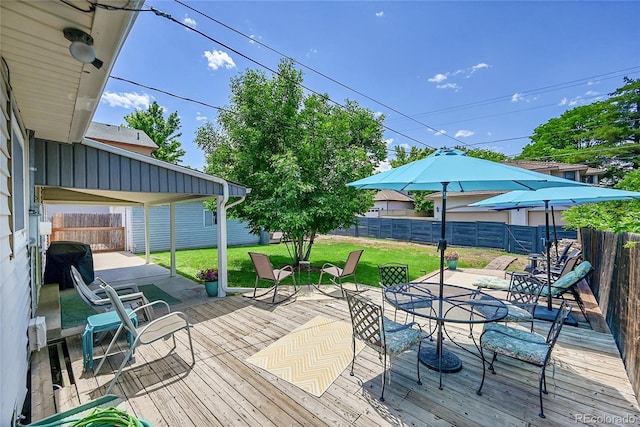 3313 S Dexter St, Denver, CO 80222 - wooden deck featuring outdoor dining space and a fenced backyard