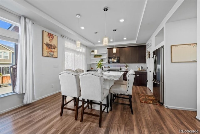 10909 Memphis Ct, Commerce City, CO 80022 - dining room with a raised ceiling, dark wood finished floors, baseboards, and recessed lighting