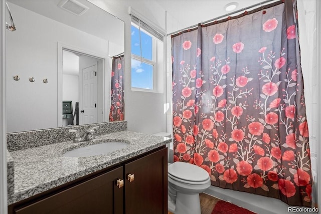10909 Memphis Ct, Commerce City, CO 80022 - full bath with vanity, toilet, and wood finished floors