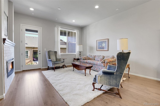 living room with light hardwood / wood-style flooring